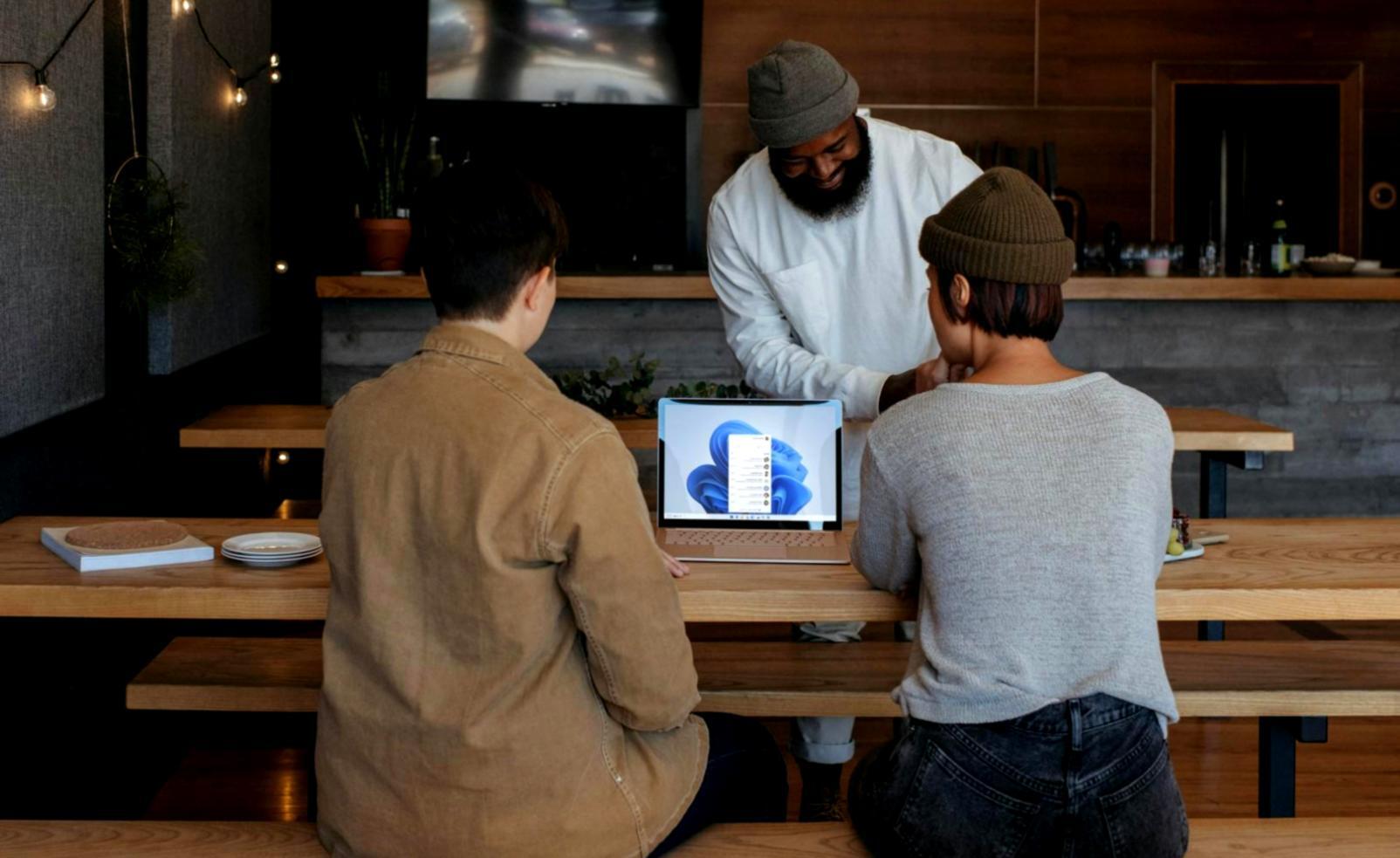 Financial planning workspace with documents and laptop showing budget analysis
